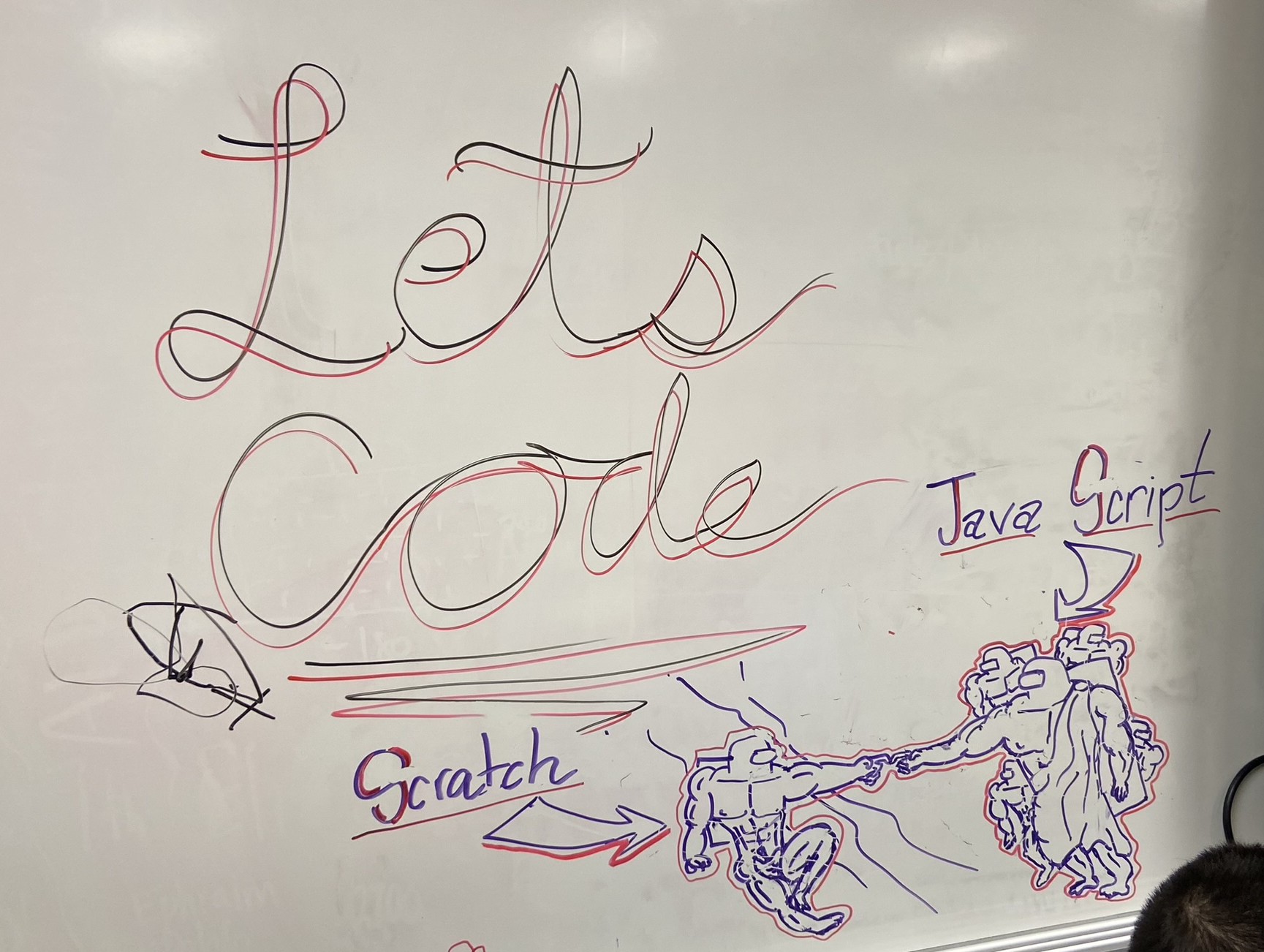 "Let's Code" written on a whiteboard